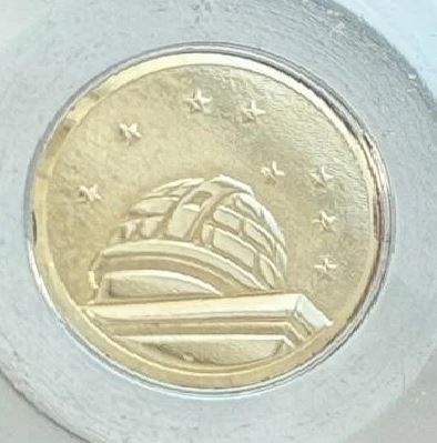 Omega Constellation medallion.